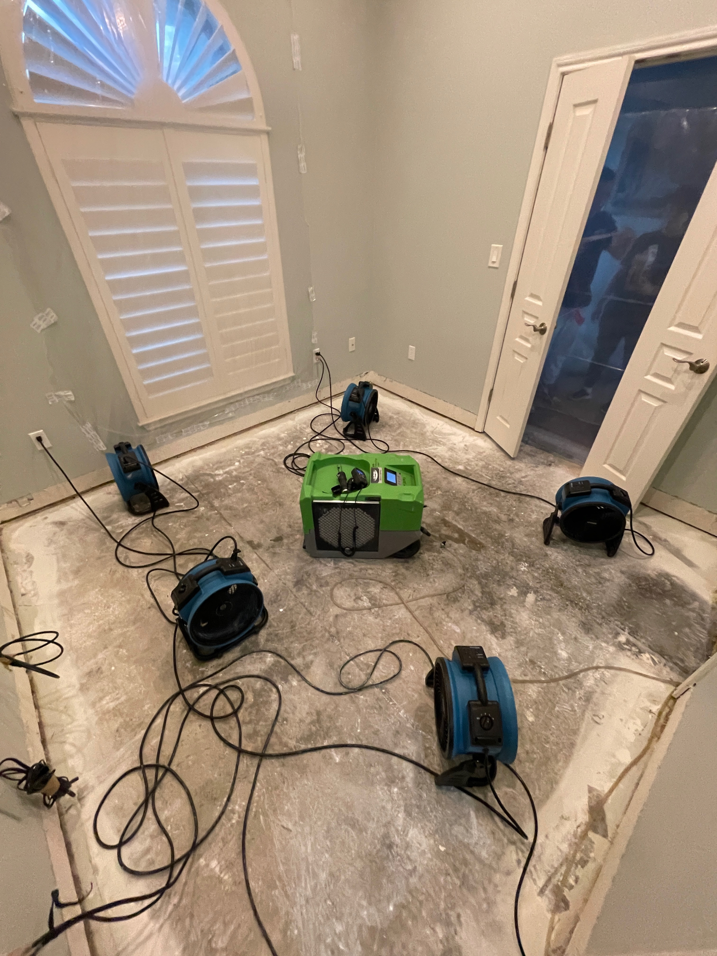 Professional water damage drying equipment - dehumidifiers and air movers for bamboo floor restoration