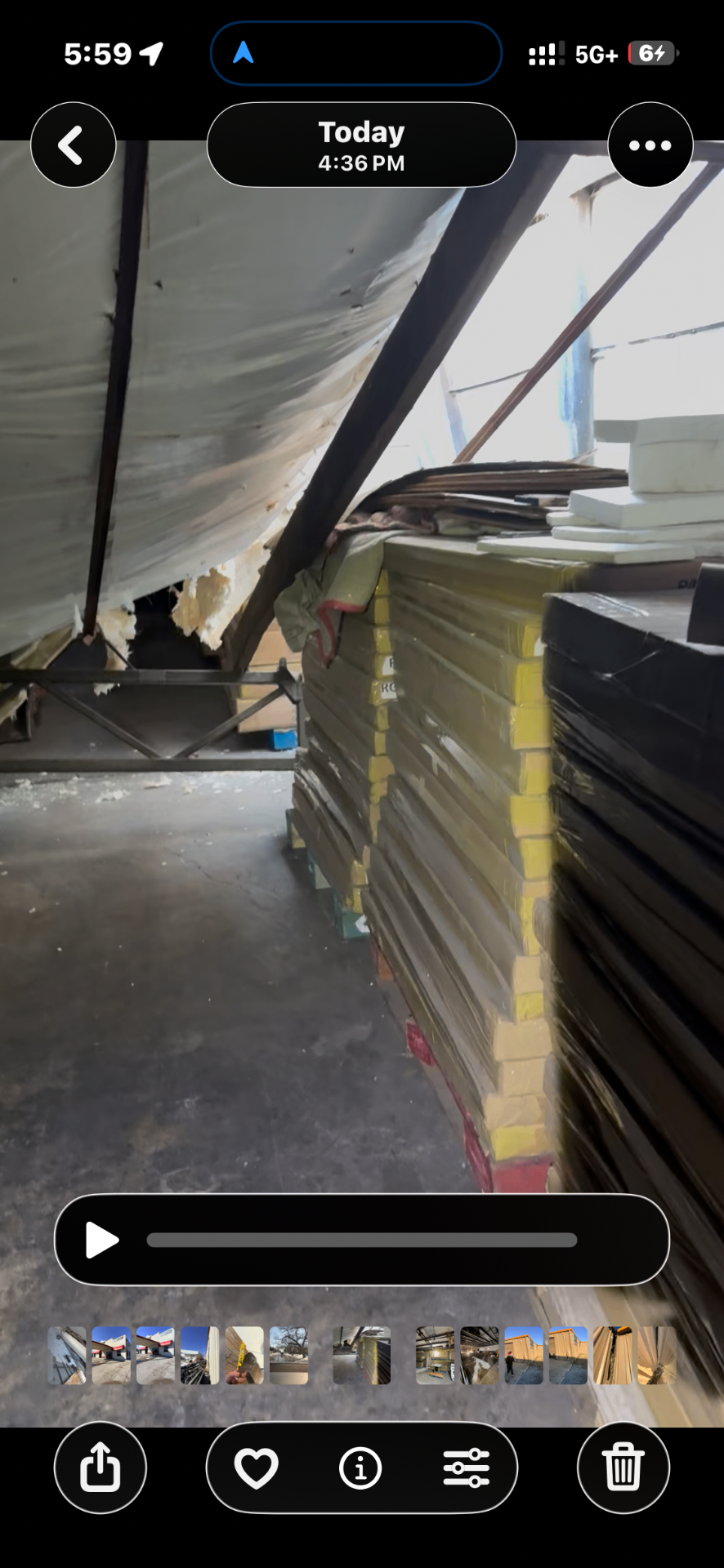 Palletized inventory stored beneath compromised steel framing inside Gainesville metal building