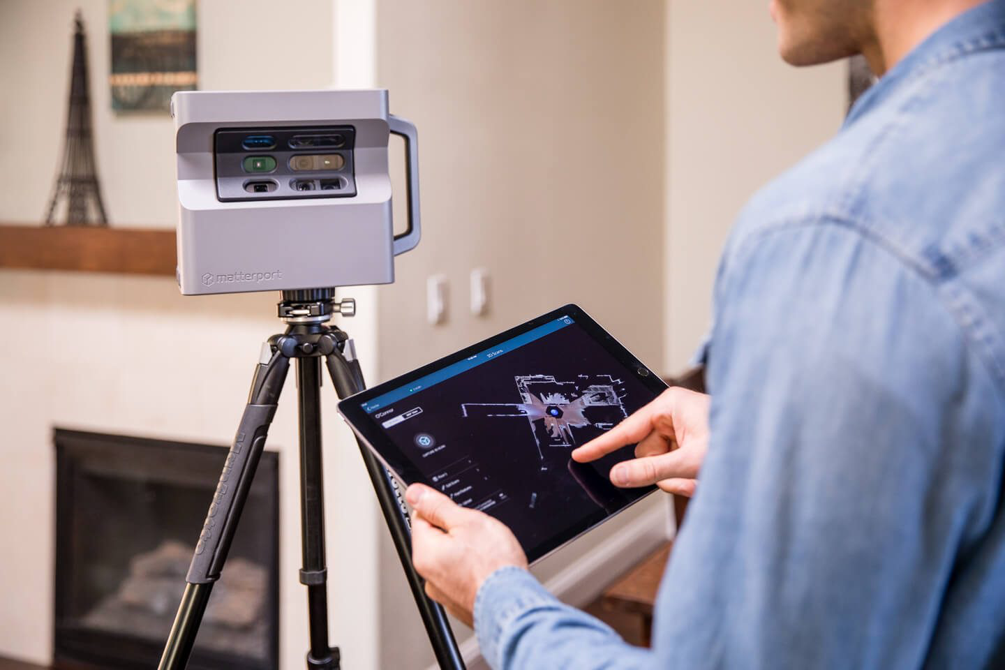 Professional using Matterport 3D scanning technology for precise water damage documentation