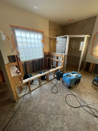 Before – Bathroom demolition and drying equipment during sewer backup restoration – New Braunfels