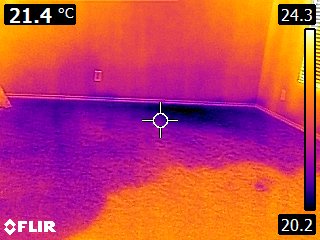 FLIR thermal imaging showing moisture underneath carpet and flooring with temperature gradients